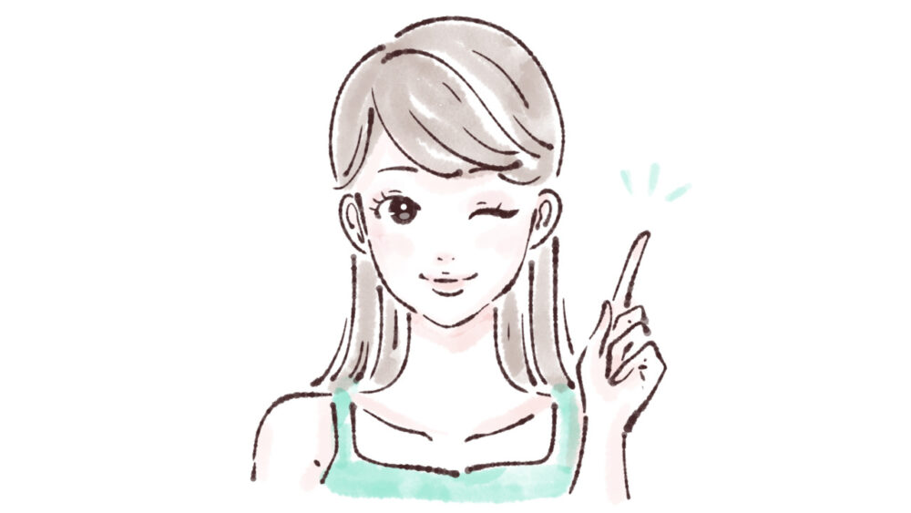 ウインクして人差し指を立てる女性