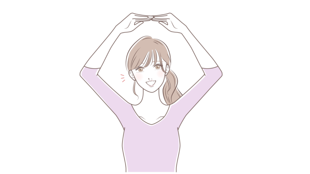 手でまるのポーズを作る女性
