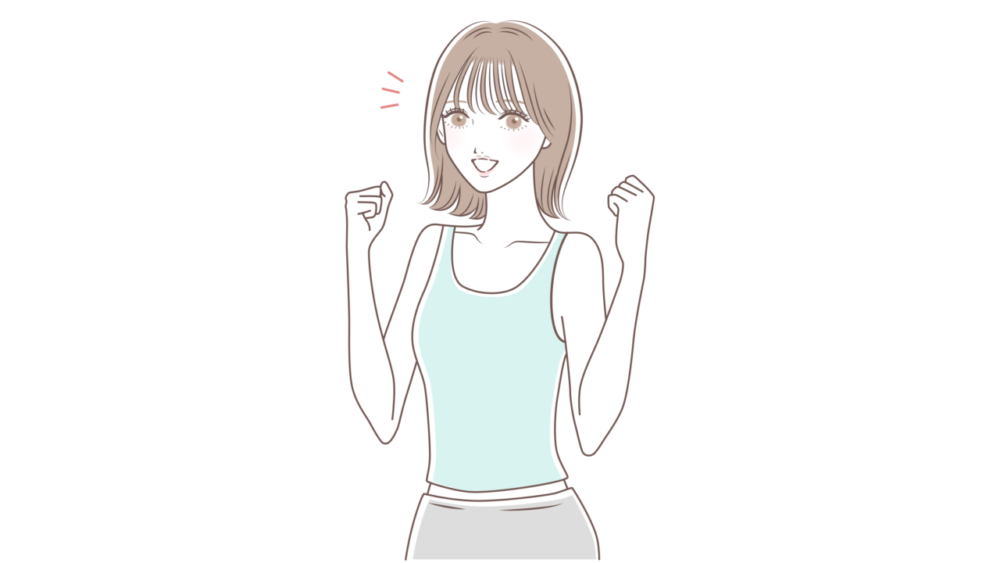 両手でガッツポーズする女性