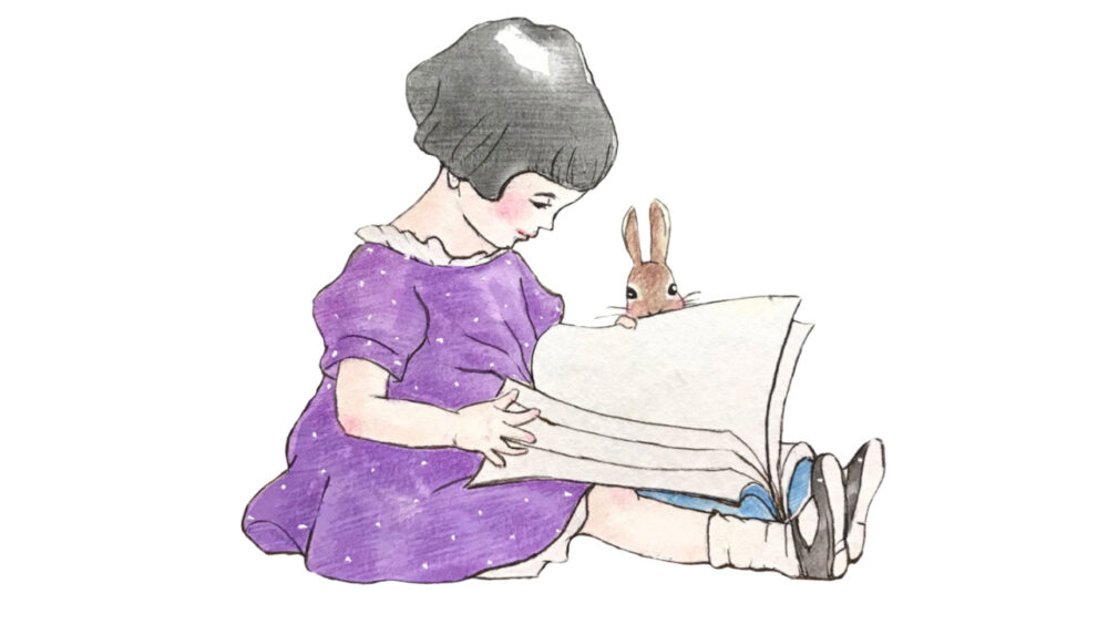 読書をしている少女とうさぎ